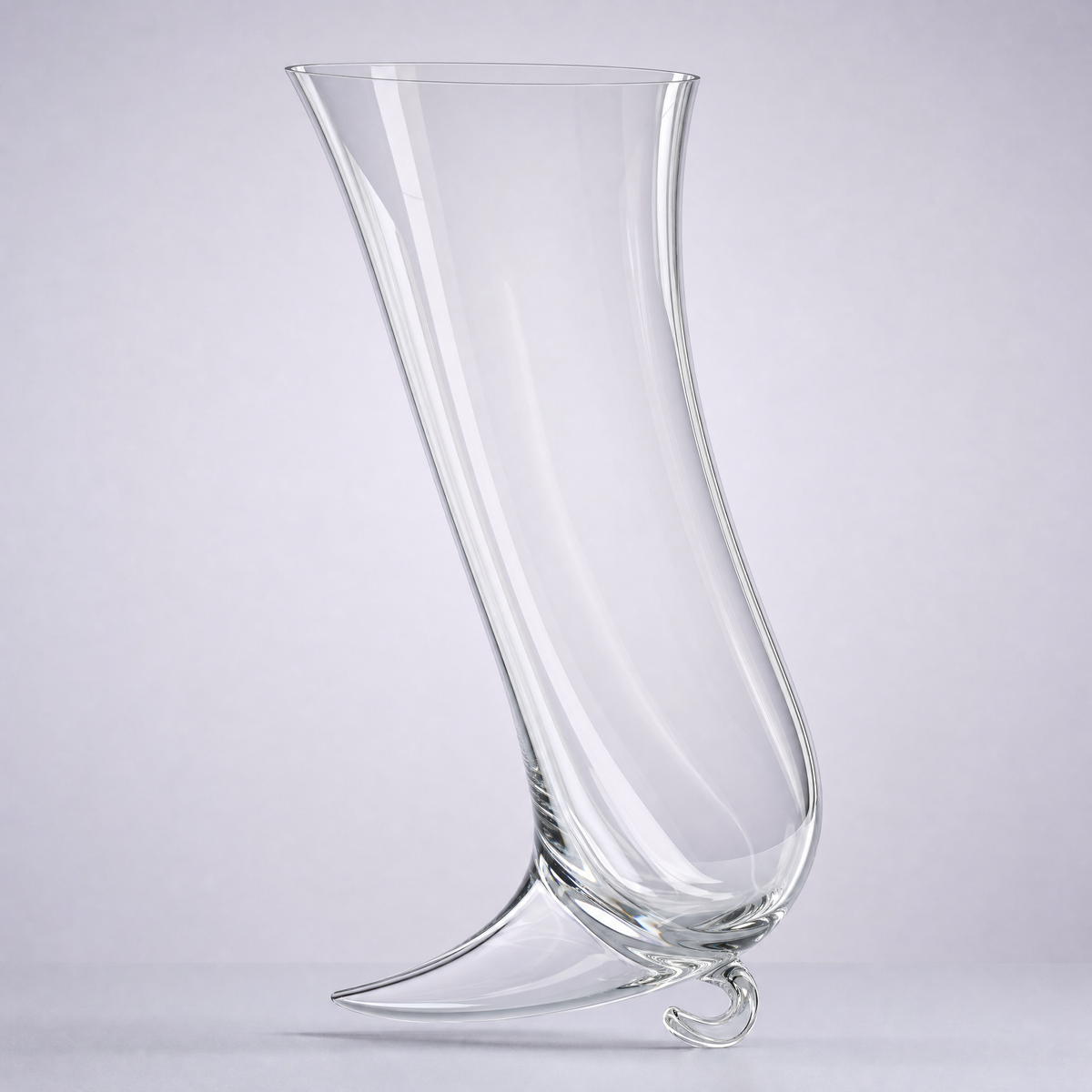 Horn decanter, a tapering crystal horn resting on a small curled glass foot