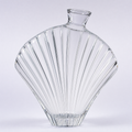Shell decanter, a fan-shaped crystal body with deep optic ribs radiating from the base