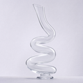 Serpentine decanter, a continuous S-curve of clear crystal on a small disc foot