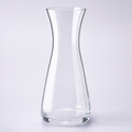 Cove carafe, a slim waisted crystal cylinder flaring at the base and the open top