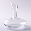 Plume decanter, a wide low round-bellied crystal body with an angled neck and drawn lip