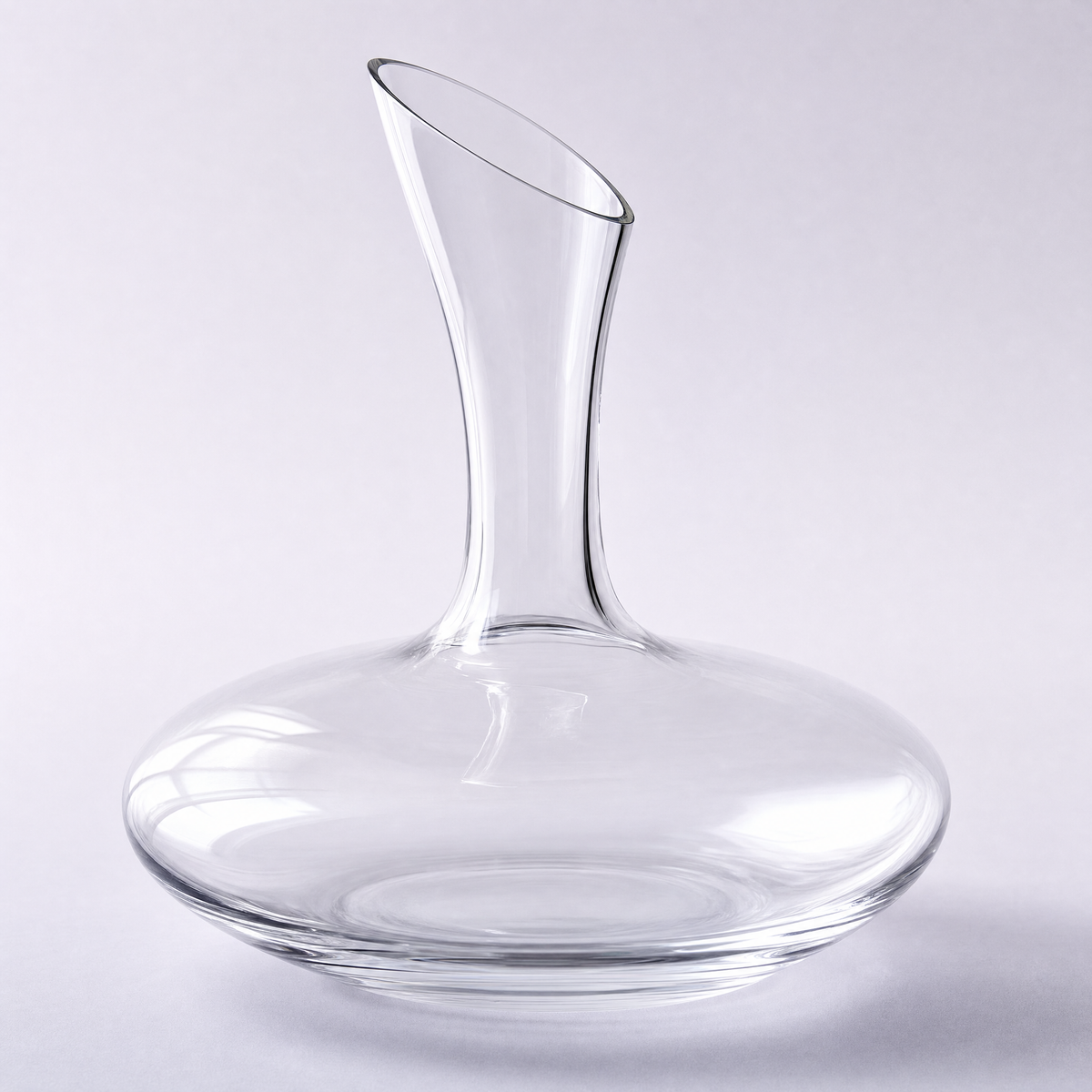 Plume decanter, a wide low round-bellied crystal body with an angled neck and drawn lip
